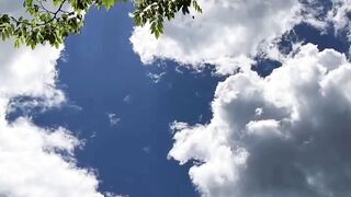 Dramatic White Clouds Against Blue Sky
