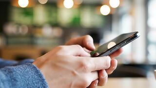 Smartphone screen interaction motion video for digital communication and technology concepts