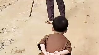 a little kid imitates grandma's walking style