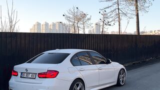 Scarred - sleek white sedan on urban street | Trending HD Video