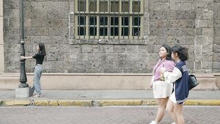 Travelpro - casual walk outside historic stone building | Trending HD Video