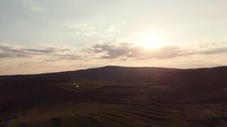4K resolution - stunning aerial sunset over rolling hills landscape | Trending HD Video