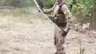 Ukrainian soldier detonates mine with a large stick