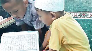 Children Reciting Quran Together In The Mosque
