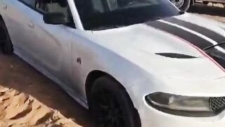 A car got stuck in the sand