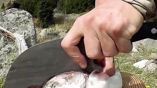 Cooking fish by the river.