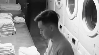 Suspicious Man Folding Towels in Black and White Laundry Room