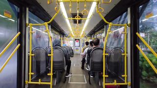 Modern Bus Interior with Yellow Handrails 2
