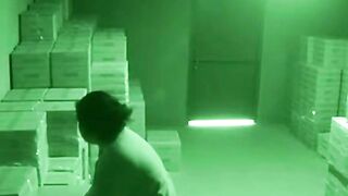 Night Vision Security Camera Footage of Woman in Warehouse
