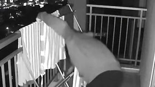 CCTV Security Camera Footage of Boy on Apartment Balcony at Night