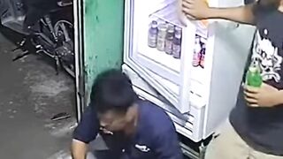 Security Camera View of Two Young Men in a Convenience Store at Night
