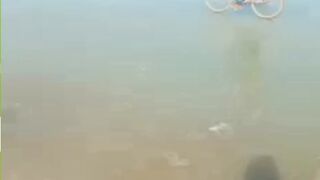 A man rides a bicycle on frozen water in Balochistan.