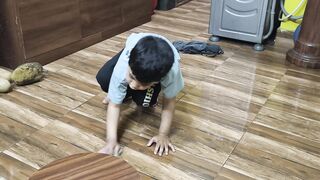 My son helping his mother by cleaning the kitchen floor