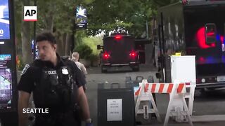 Police arrest one suspect and search for another in Seattle shooting that killed 3