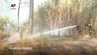 French firefighters continue to battle wildfires in forests west of Bordeaux