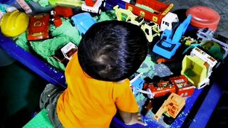 A children boy playing many toys for have fun