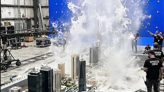 Film_crew_flooding_miniature_city_202608121024.mp4