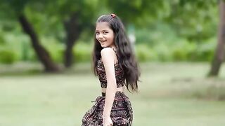 Small girl dance in garden