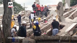 Colombia rescuers ask for silence as they listen for signs of life after earthquake