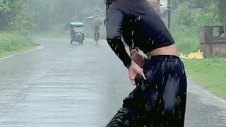 Young girl dance in Rian on road