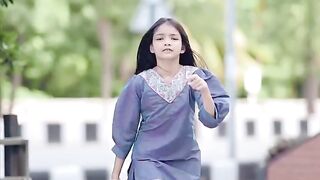 Little girl dance on road