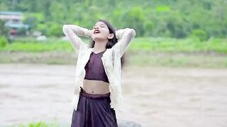 Little girl dance on river side