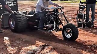 Motorcycle Pulling a Massive Weight