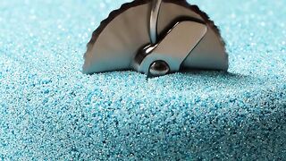 Metal padlock submerged in blue epoxy resin for DIY crafting and secure sealing projects