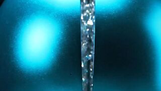 Glowing blue plasma sphere with electric discharge on black background for science and energy concepts
