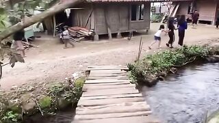 Clear water flows near the house.