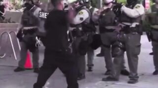The man will regret throwing the bottle at the cops