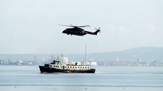 Military Halicopter Over a Ship
