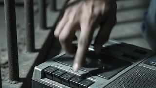Man_plays_warning_cassette_tape