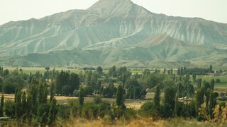 Beautiful mountain landscape with lush greenery and clear skies