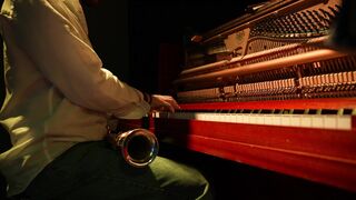 Jazz Pianist Playing Elegant Solo with Saxophone