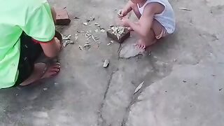 Children Playing Together Outdoors in a Simple Neighborhood Setting