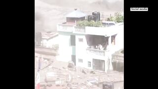 In Nepal, a home resists devastating floodwaters and protects family members.