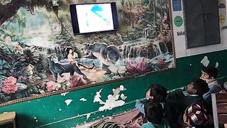 Students watching cartoons during break