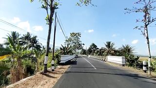 Walking along the road in the village of Purworejo Indonesia