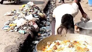 Street Food Vendor Prepares a Giant Pan of Delicious Food