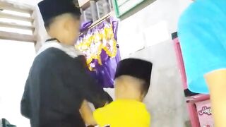 Muslim children in traditional clothes — togetherness (atau) Simple Islamic childhood — beautiful family moment