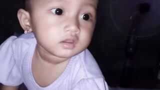 Cute baby in purple — innocent and lovely (atau) Adorable little baby — pure and sweet