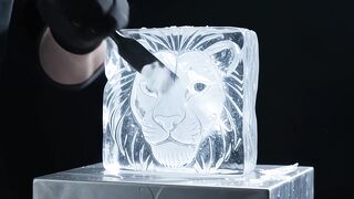 Craftsman carving lion in ice block
