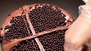 My arm was smoking from swinging it around, and here are some chocolate-covered crunchy chocolate pearls that my chocolate-loving head loves