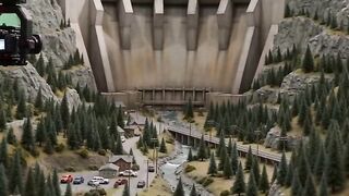 Filmmaking Dam Bursts Across Miniature Valley