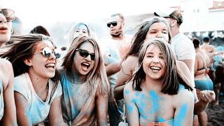 Women Shouting and Celebrating as Colored Powder Fills the Air
