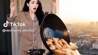 A woman was frying chicken wings
