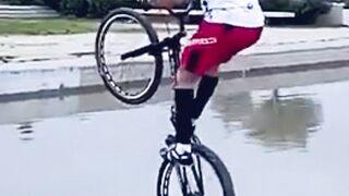 Cyclists Defy Gravity and Leap Over the Water!
