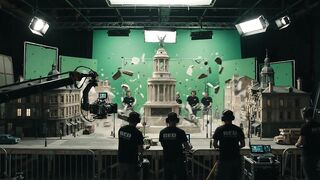 FILMMAKING CREW DESTROYING MINIATURE LANDMARK