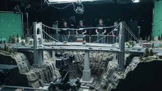 FILMMAKING CREW OPERATING MINIATURE EARTHQUAKE
